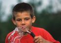 A child enjoys a drink of fesh water
Picture # 3370
